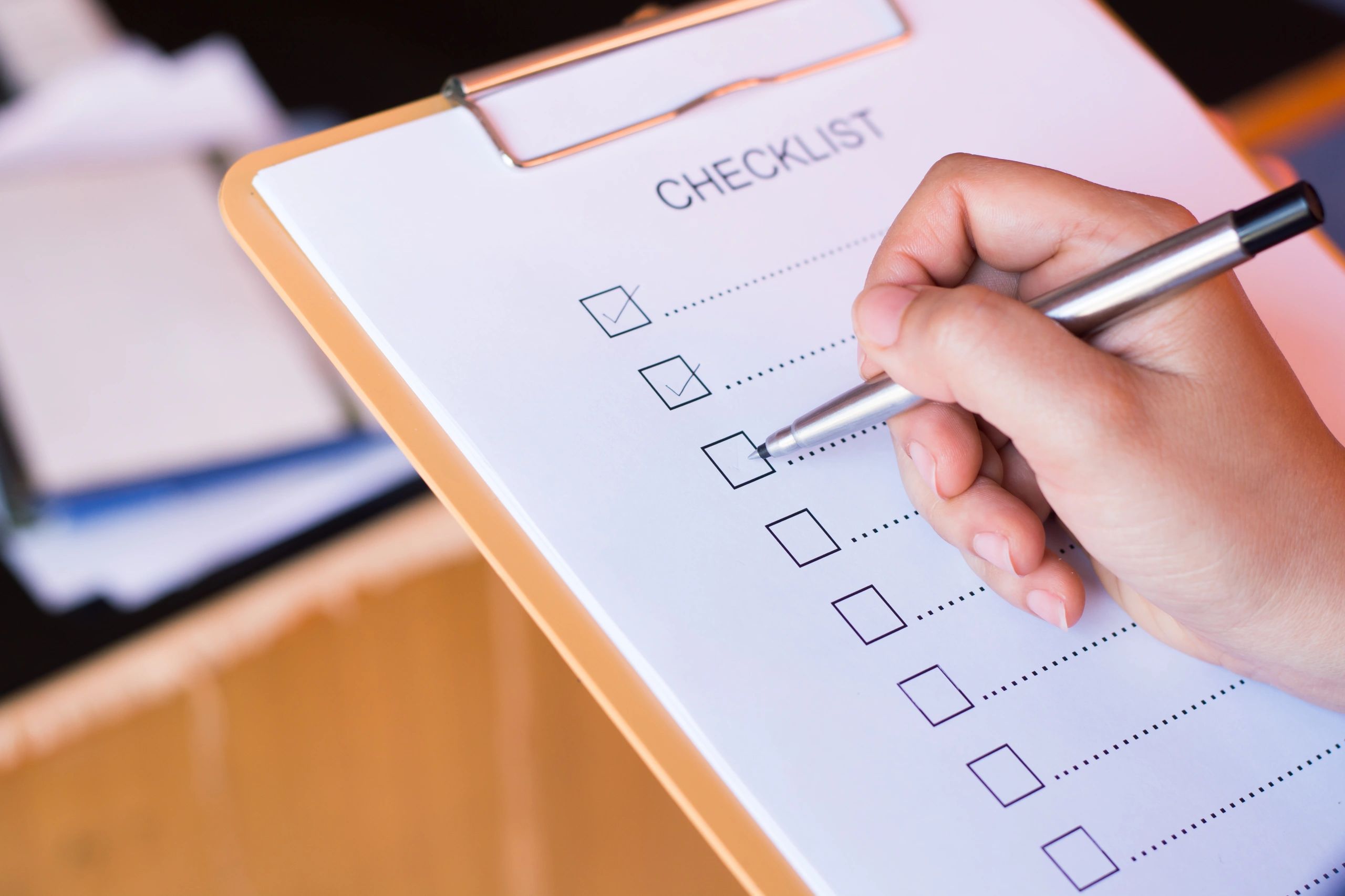 Professional preparing an internal audit checklist to support risk management